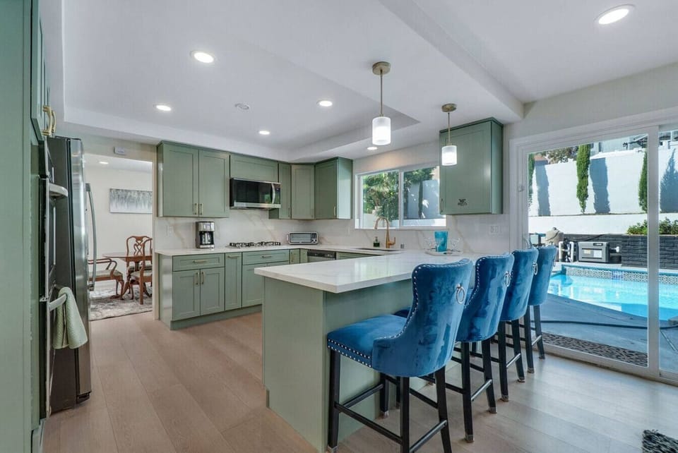 Updated kitchen with breakfast bar and stainless appliances.