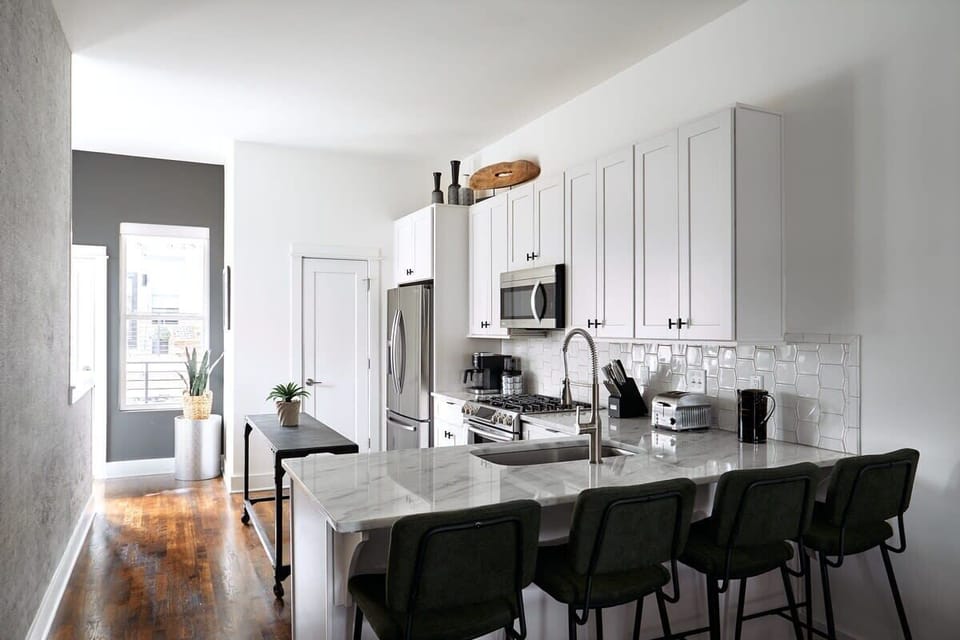 The Austen: Pull up a seat at the kitchen bar—perfect for casual bites, morning coffee, or keeping the chef company.