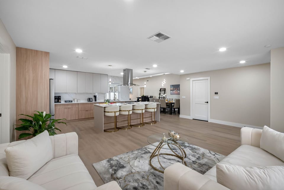 A blend of comfort and sophistication, this living area invites you to sink into soft seating and enjoy tranquil evenings with loved ones.
