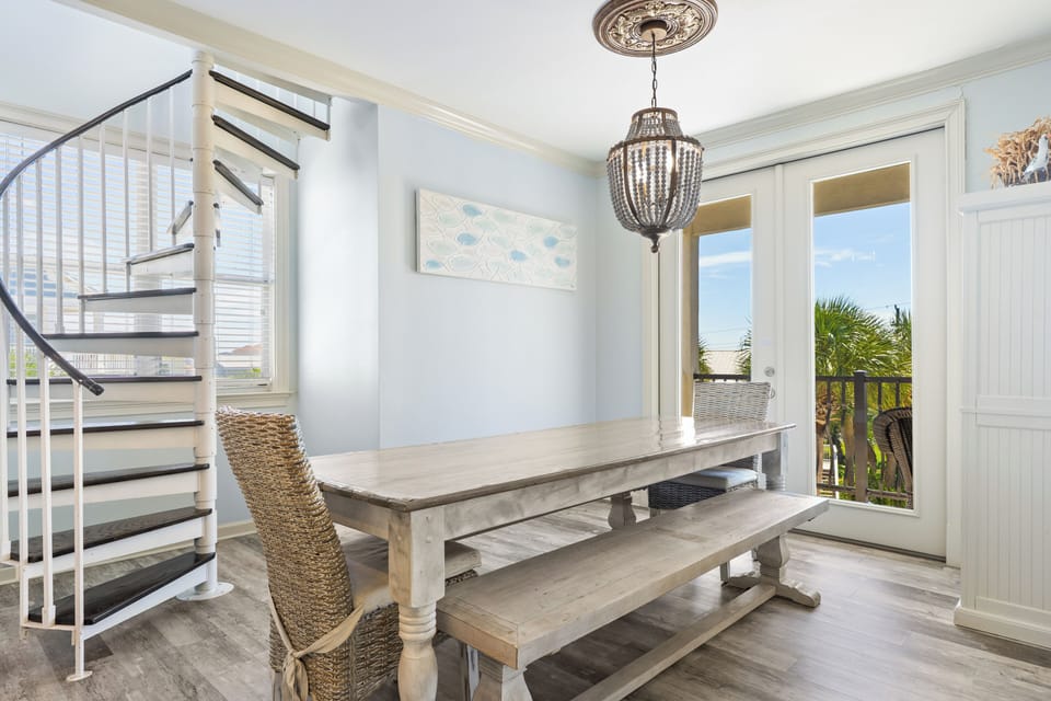 Dining area with a long wooden table for group meals.