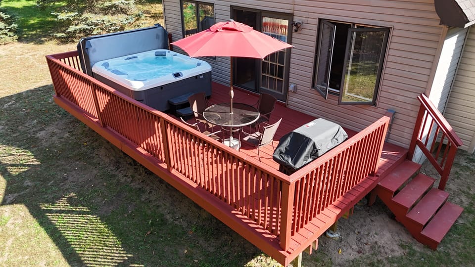 OVERVIEW:   Aerial view highlighting the new hot tub, outdoor dining furniture, and new gas grill.