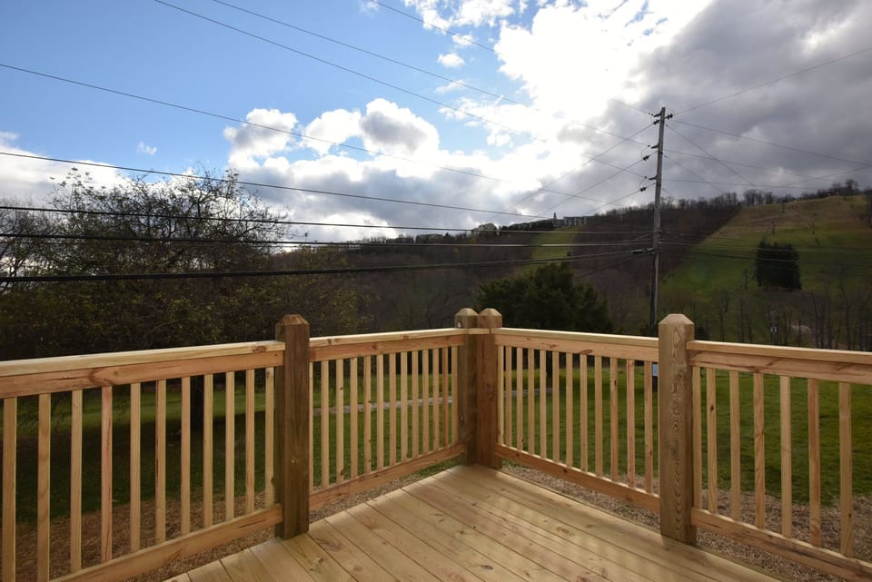 Scenic deck with stunning views of the surrounding landscape, ideal for enjoying a peaceful morning or evening outdoors.