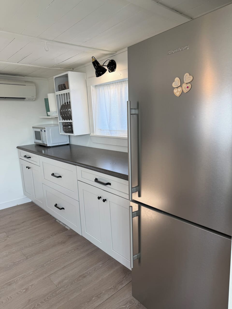 Full Fridge, microwave, k-cup coffee maker and blender on this side of kitchen.