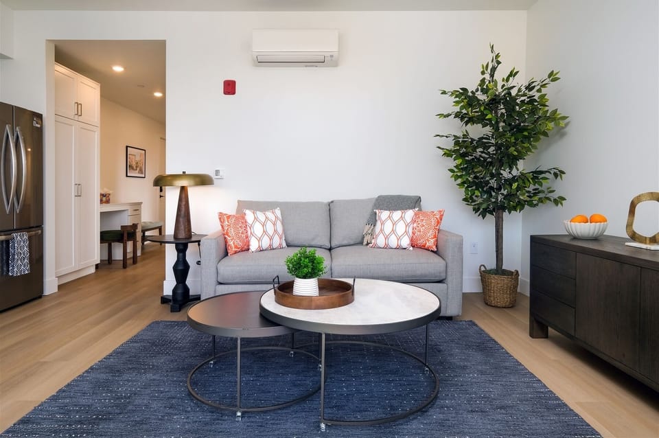 Living room features a queen sized sleeper sofa for additional sleeping space