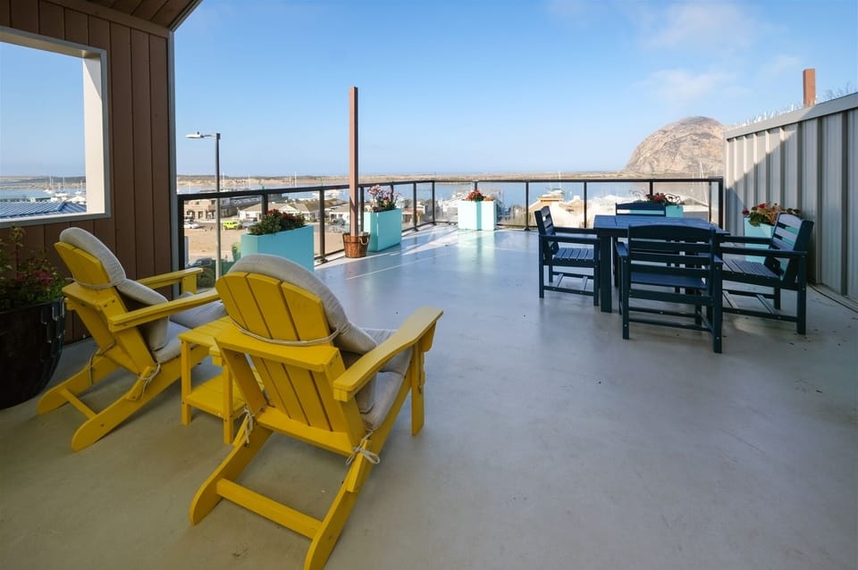 Step outside onto your private deck to enjoy views of the rock and harbor beyond