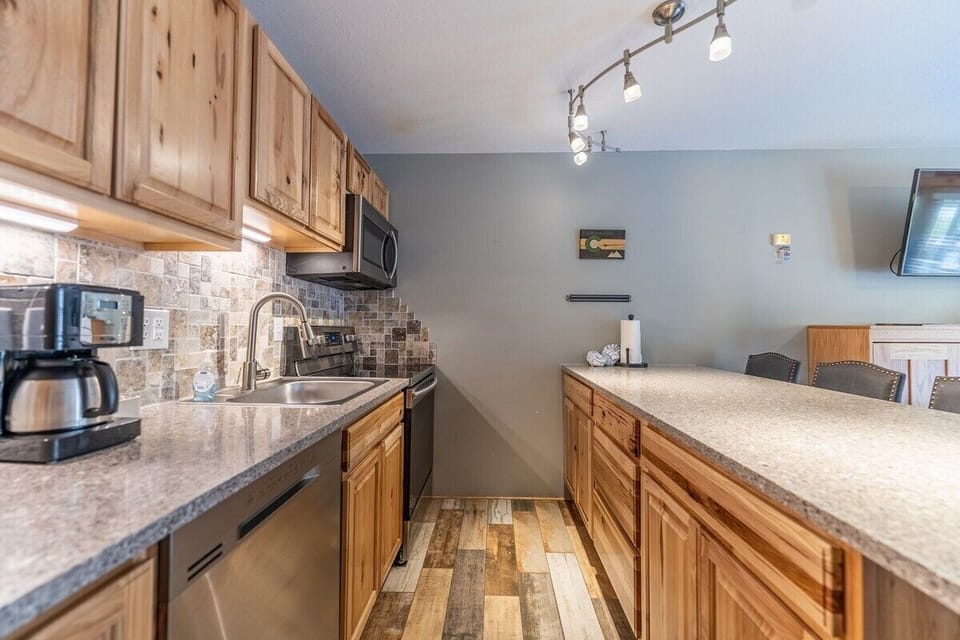 Full-size & fully stocked kitchen with upgraded stainless steel appliances.