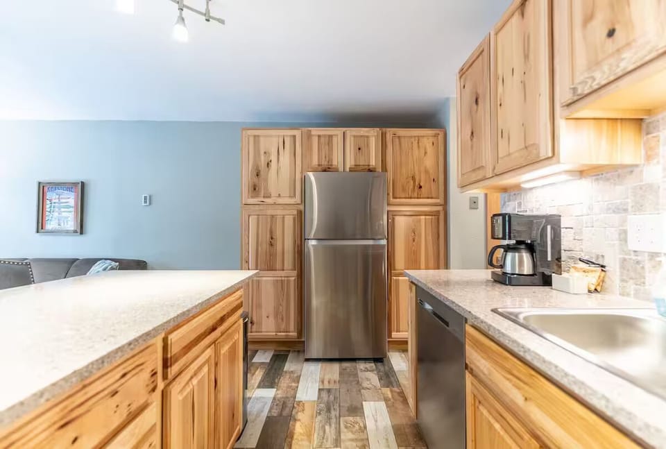 Full-size & fully stocked kitchen with upgraded stainless steel appliances.
