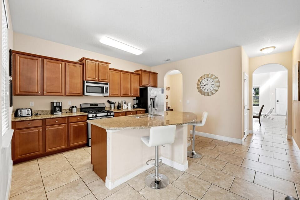 Spacious kitchen with wood cabinets