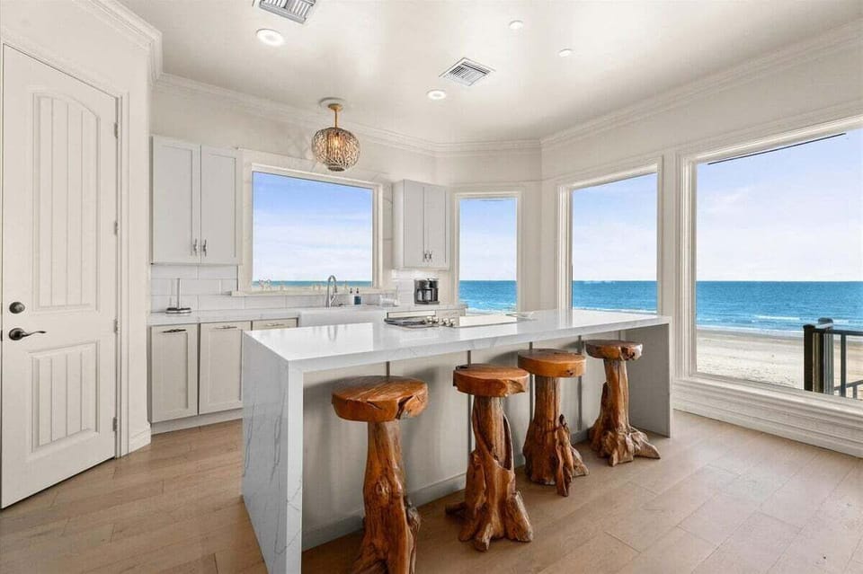 A culinary masterpiece, this chef's kitchen offers a front-row seat to the sea — where every meal is prepared with the ocean as your backdrop.