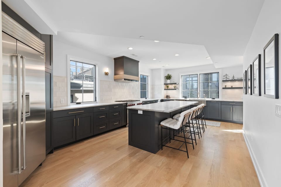 Kitchen: Main floor, drip coffee maker, air fryer, toaster, cooking utensils, tableware