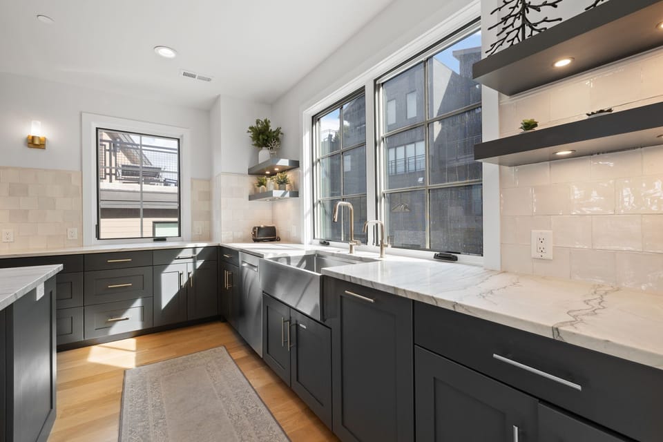Kitchen: Main floor, drip coffee maker, air fryer, toaster, cooking utensils, tableware