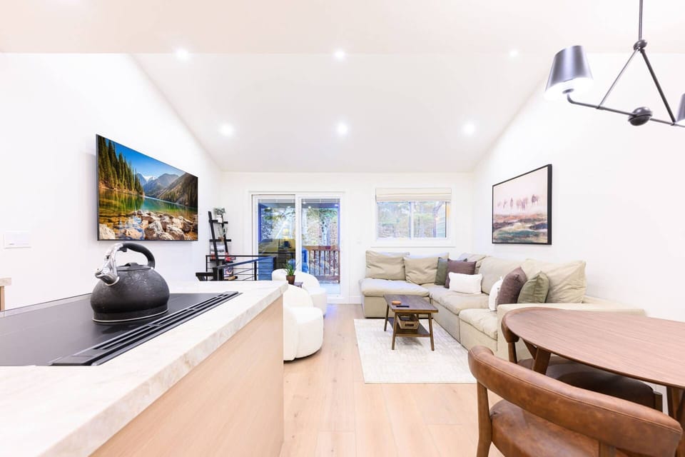 Open-concept living space connecting kitchen and dining area.