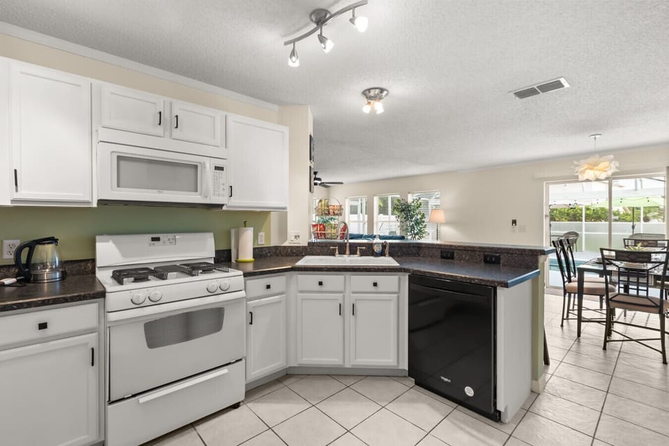 Open kitchen overlooking the dining and living areas — perfect for cooking while staying connected with family and friends.