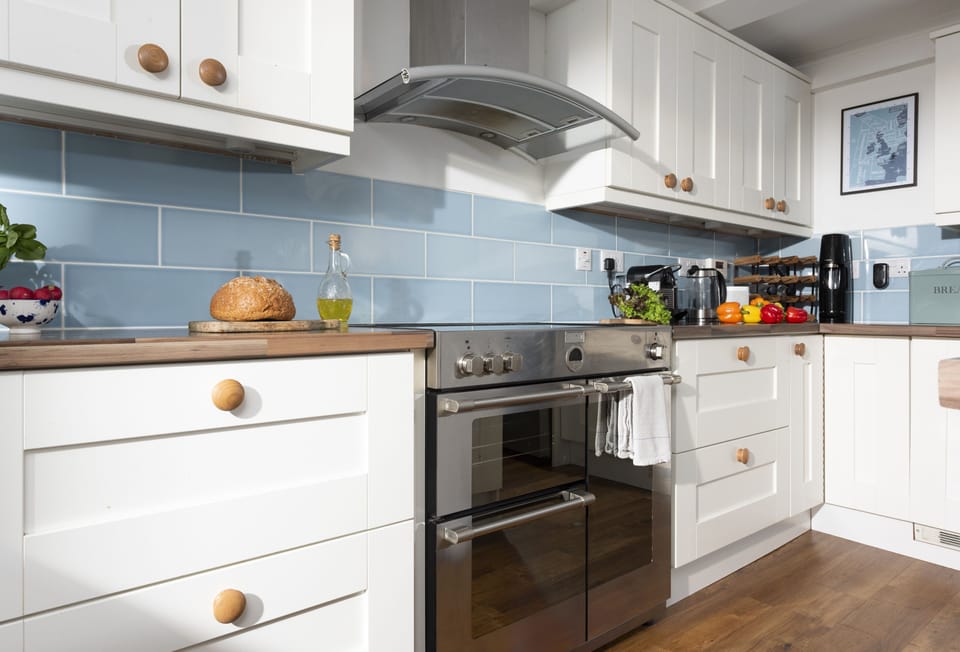Little Tresevens, Polzeath. Ground floor: Kitchen with a Samsung electric range oven, American-style fridge freezer, microwave, Nespresso coffee machine & milk frother, dishwasher, washing machine, and tumble dryer