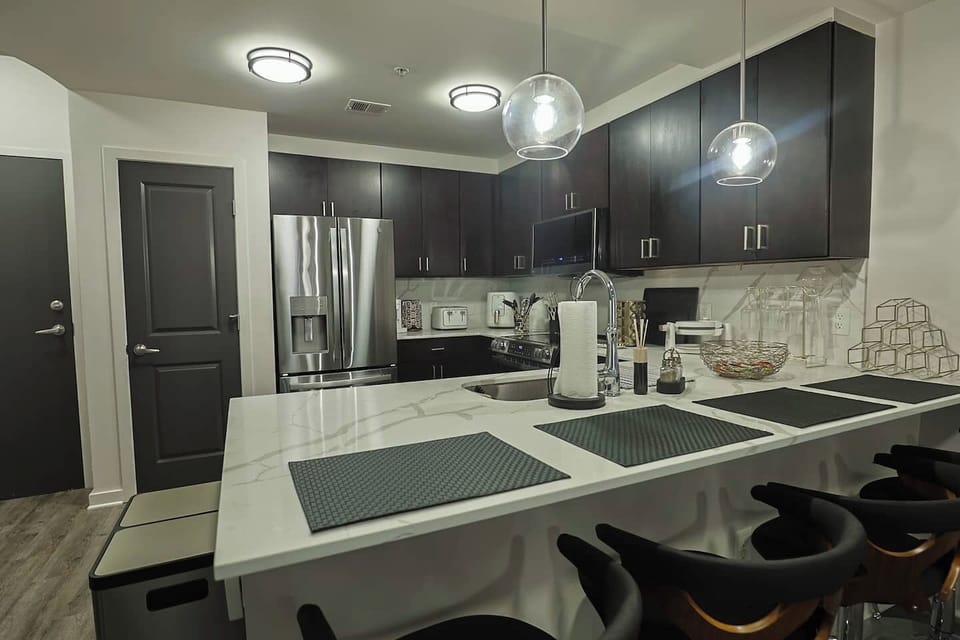 Microwave, oven, and fridge — all ready for use.