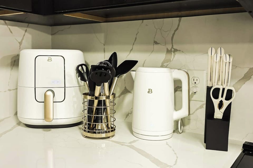 Fully stocked with cookware, dishes, and utensils.