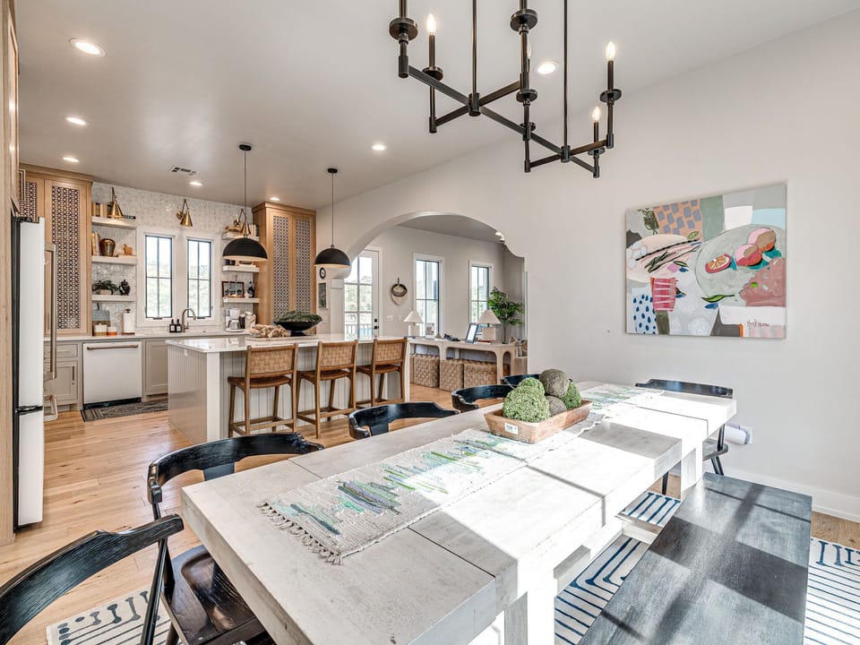 4. Bright open-concept view connecting dining and kitchen — airy, social, and great for entertaining.
