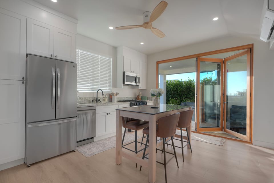 Cantina doors open up kitchen wall to patio