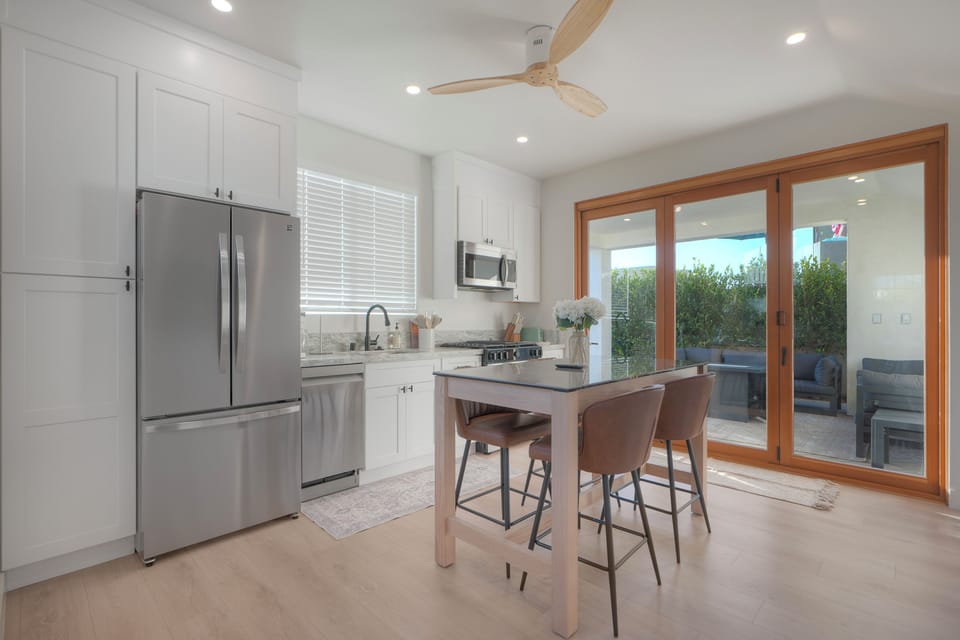 Stylish kitchen with natural light and patio access