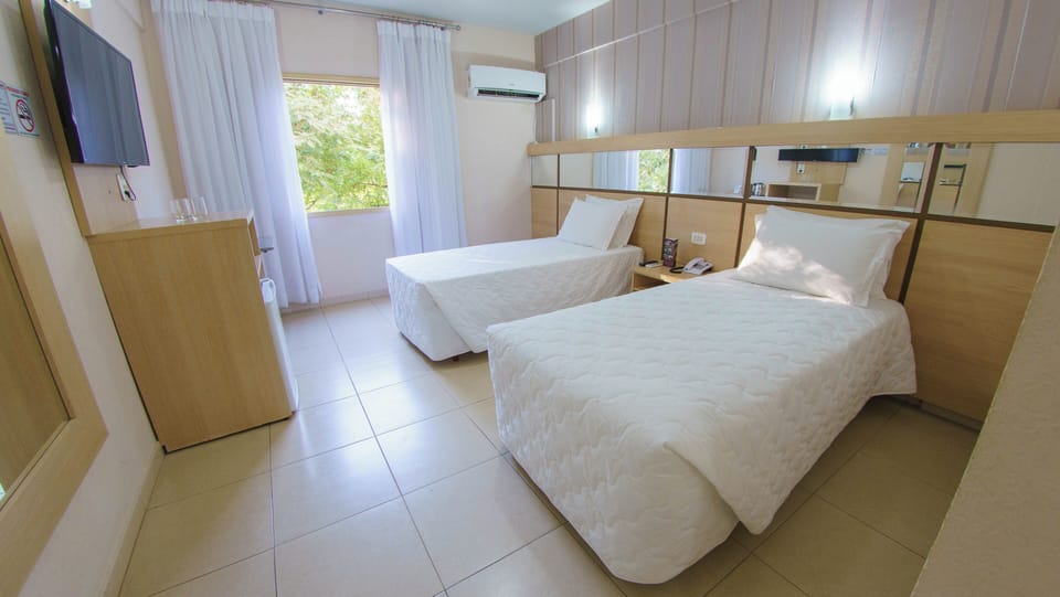 Wake up refreshed beside leafy views and crisp linens.