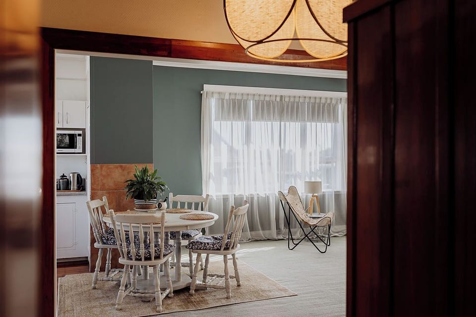 Gather here for slow meals and shared stories, surrounded by light and the hush of the day.