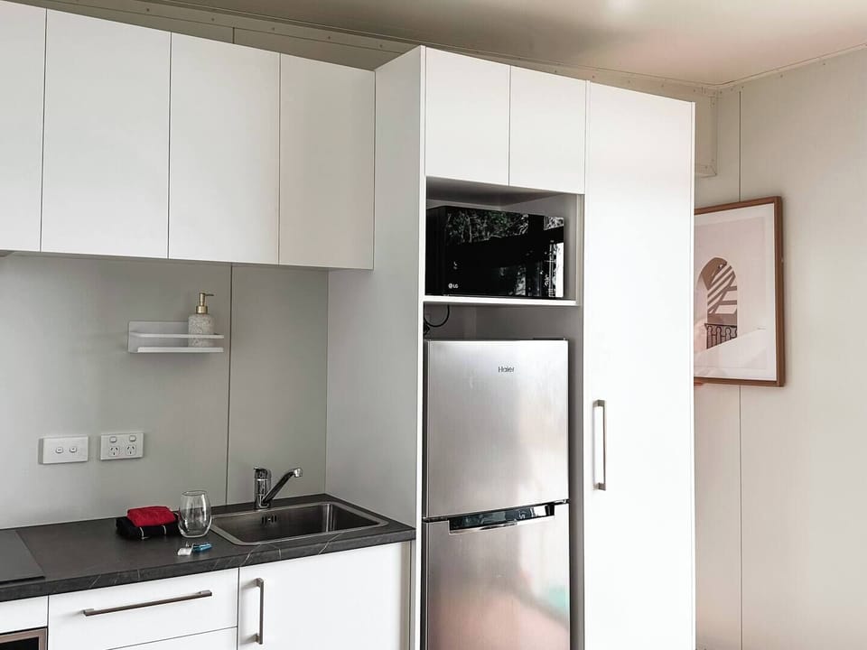 A compact, fully equipped kitchen — everything you need to prepare a meal after a day exploring.