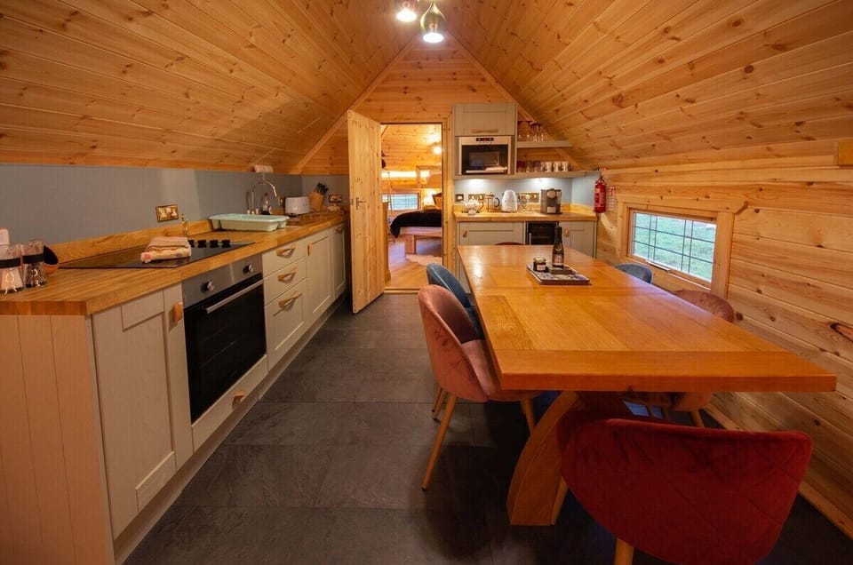 Kitchen with bedroom beyond