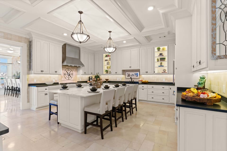 The main kitchen area features a massive kitchen island