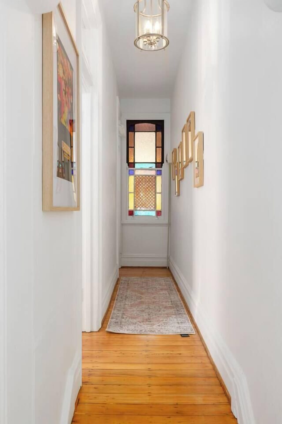 High ceilings, polished timber floors, and filtered light guide you through the home’s calm interiors, revealing thoughtful design at every turn.