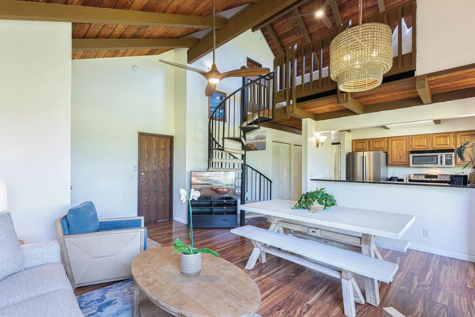 Living room with comfortable furnishings, natural light, and access to the lanai.