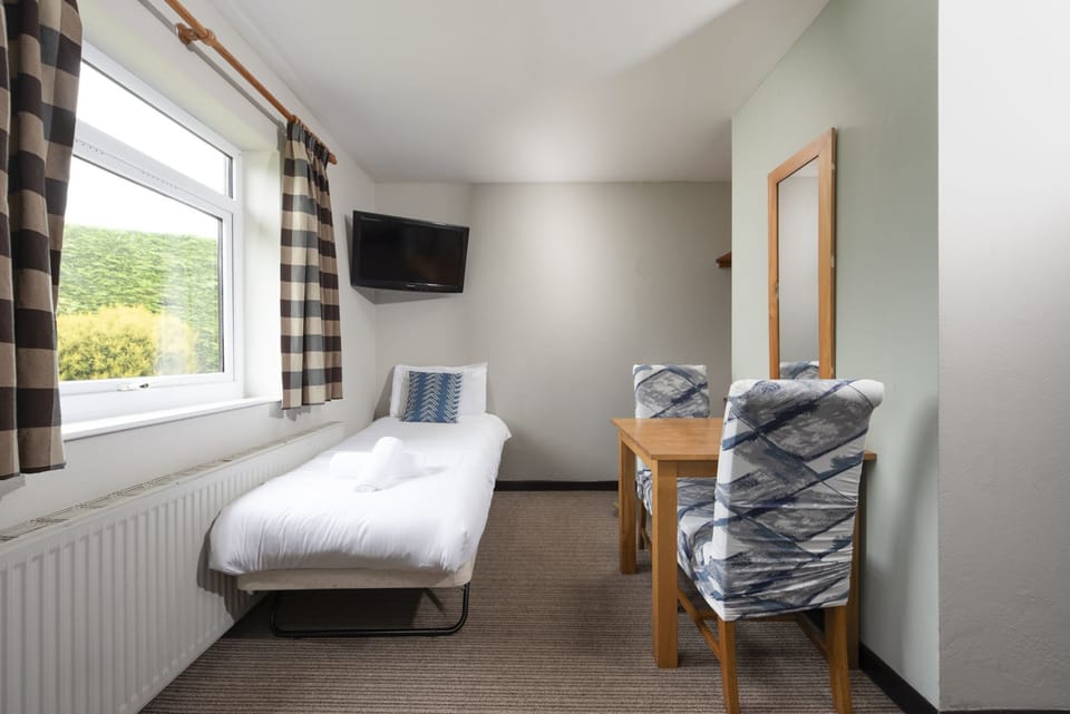 Twin beds and table for two