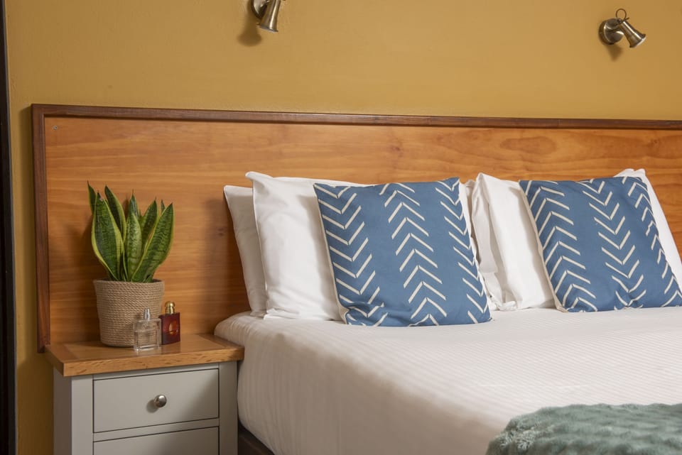 Bedside tables and overhead reading lights