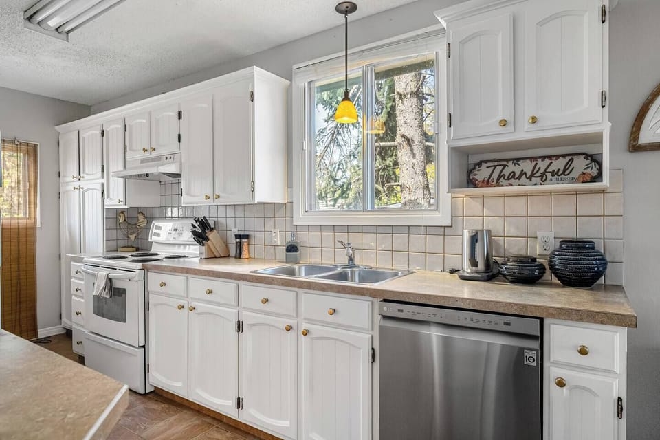 Full kitchen with a drip coffee machine, ground coffee, tea, sugar and basic condiments (ketchup, mustard and relish.)