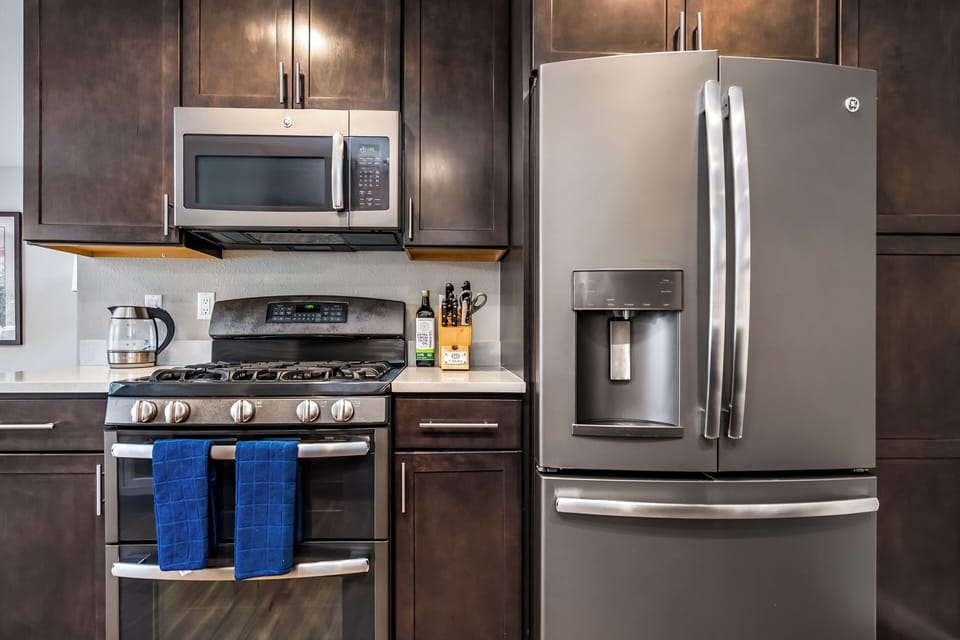 Full stove, double oven, microwave, and huge fridge to help you stay organized .