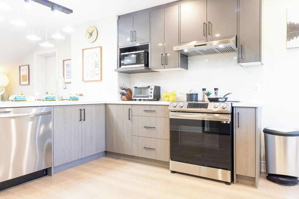 Fully appointed kitchen including, All the utensils, Plates mugs, wine and drinking glasses you'll need. Refrigerator, Induction stove/oven, toaster oven, microwave, and dishwasher. Also available coffee maker, toaster, blender...etc