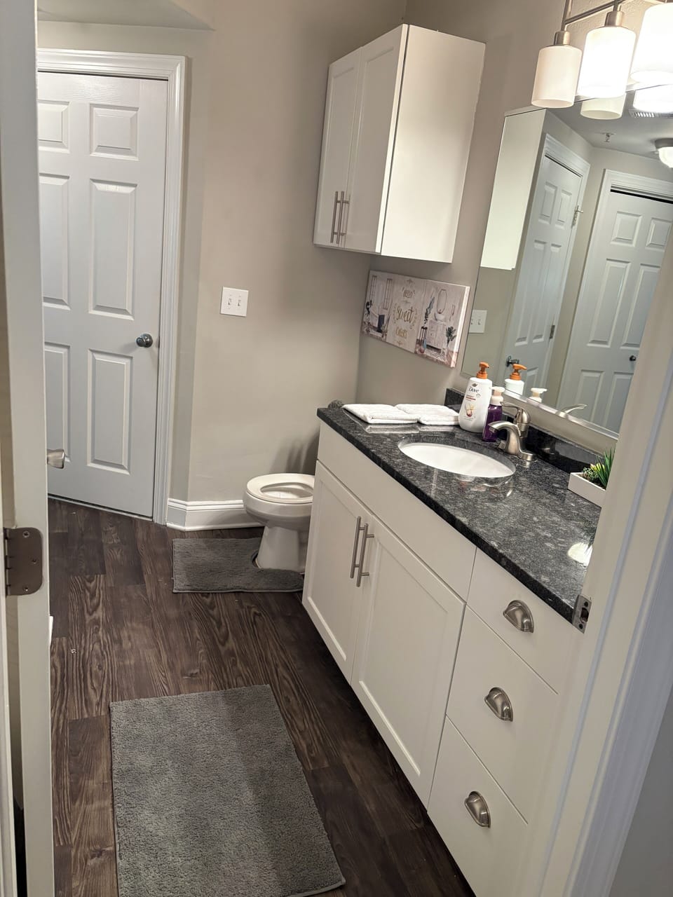 Bathroom with laundry room, there’s also two entrances to the bathroom.