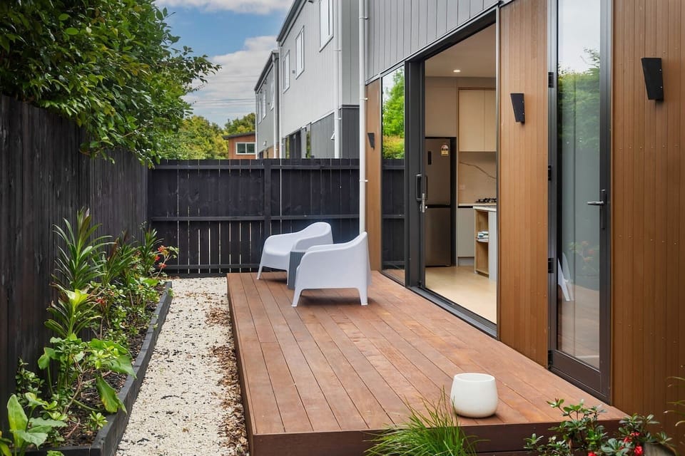 Beautifully planted outdoor space with deck, leading off kitchen/dining area, perfect for enjoying a morning coffee or afternoon drink
