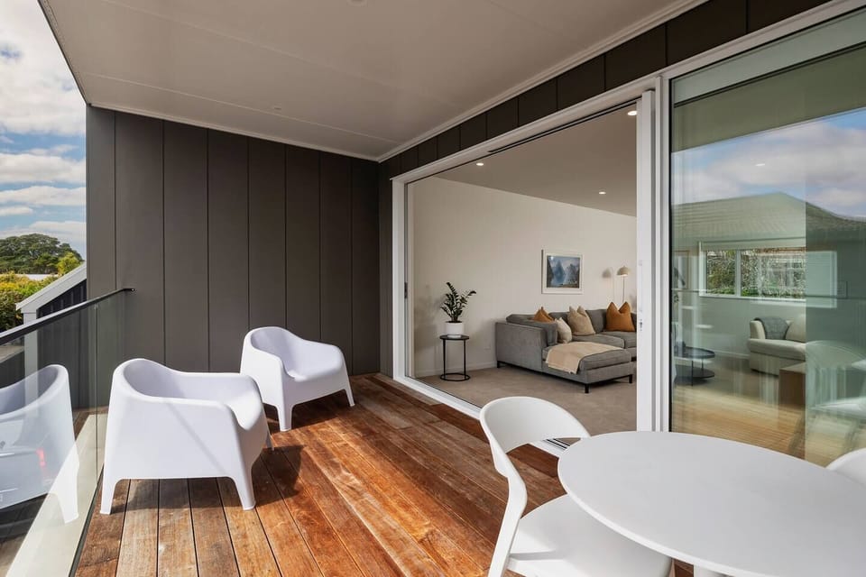 Covered balcony leading off living room, perfect for enjoying a morning coffee or afternoon drink