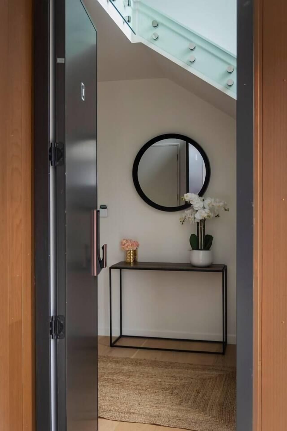 Spacious entrance hallway with staircase leading to upstairs living, bathrooms and bedrooms