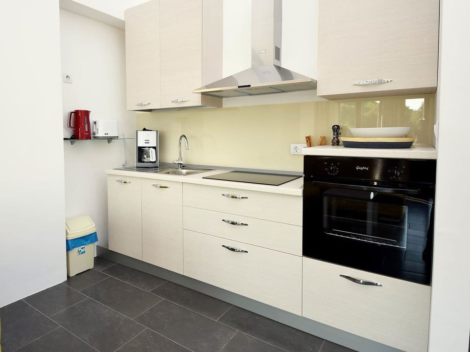 Cabinetry, Countertop, Property, Building, Furniture, Kitchen Stove, Drawer, Kitchen, Kitchen Appliance, Interior Design