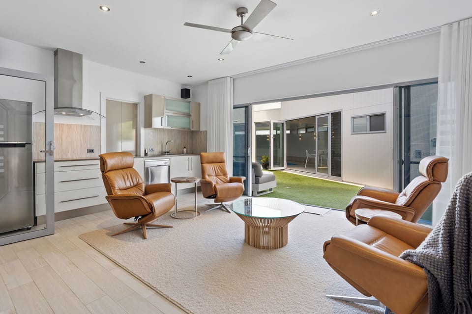 Luxe leather recliners, smart TV and flow through access to indoor pool.