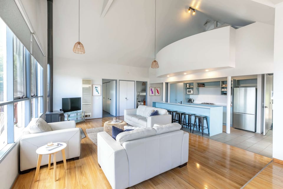 On entry level, we have a large open plan living space with adjoining laundry and bathroom plus two bedrooms