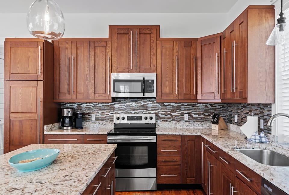 Fully stocked kitchen with reliable appliances and utensils.