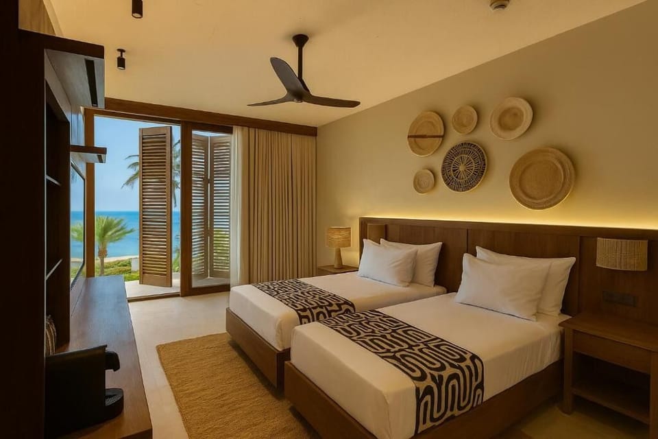 Stretch out after beach days with a calming sea vista.
