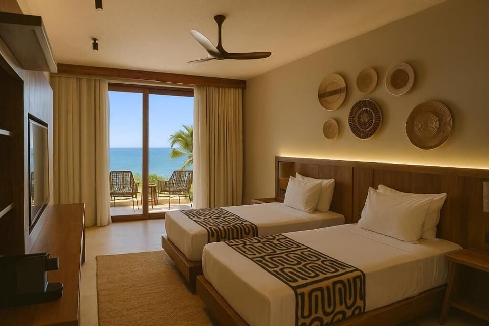 Wake to ocean breezes in a sunlit king bedroom.
