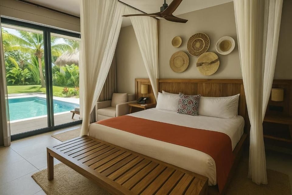 Slip into resort serenity with canopy bed and pool access.