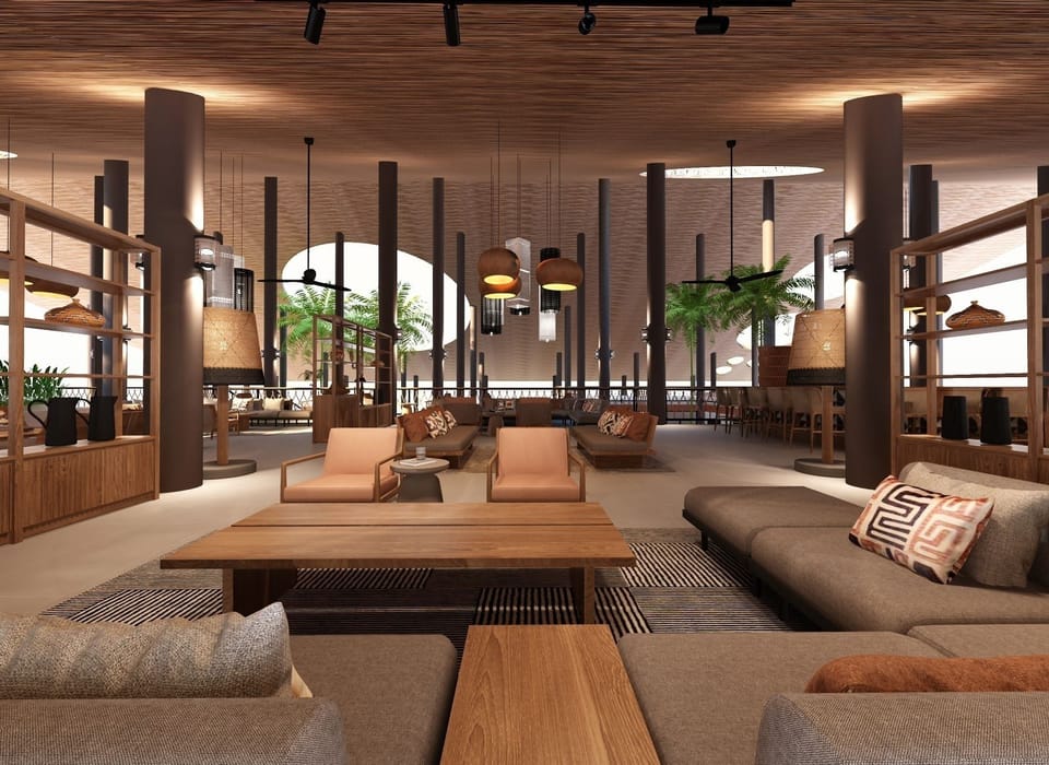 Unwind on plush seating beneath warm, modern island lighting.