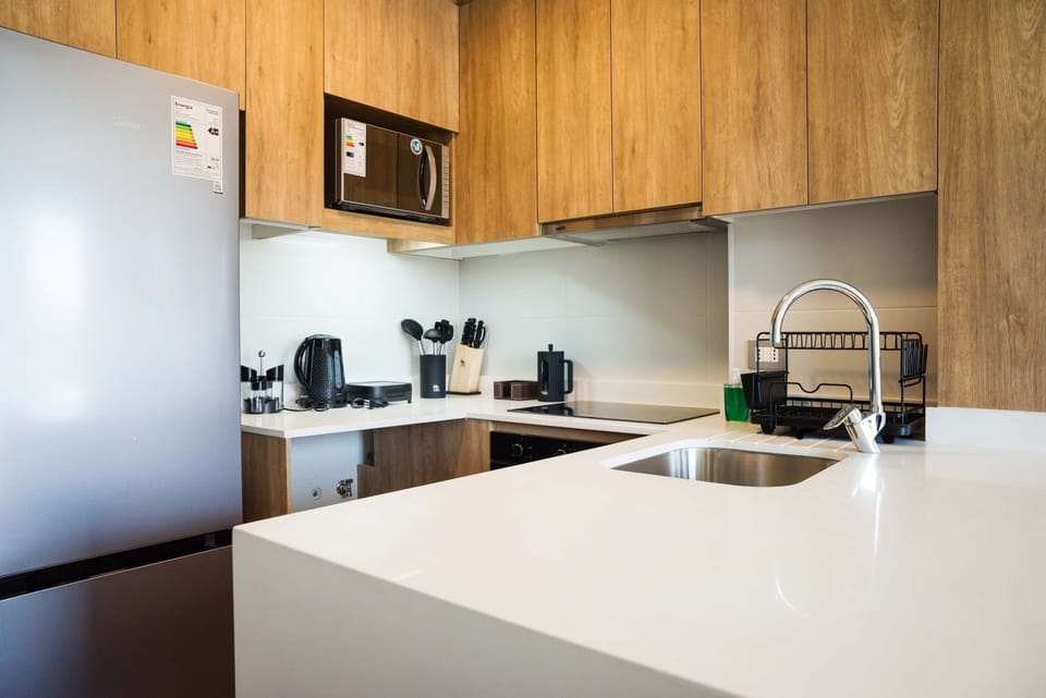 Modern kitchen with sleek appliances and all essentials for a comfortable stay in the heart of Chile.