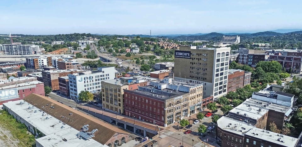 Vibrant cityscape awaits, just steps from eclectic shops and dining!