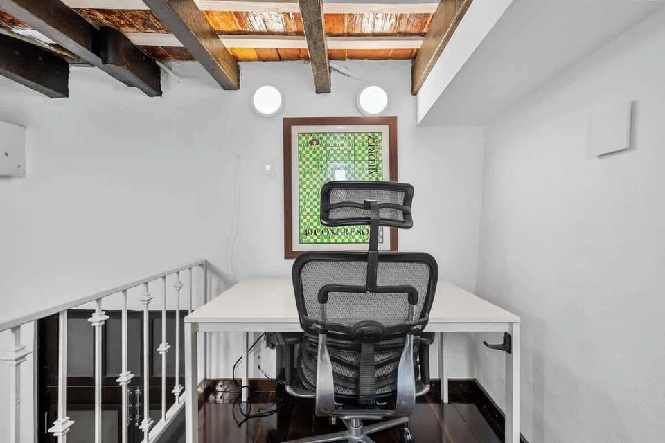 Productive space: Simple desk setup in a bright, quiet corner.	
